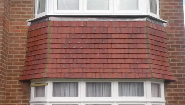roof tiling around bay window, Ruislip
